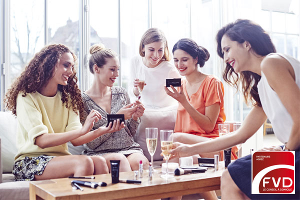Groupe de femmes souriantes essayant les produits Nutrimetics avec logo de la FVD